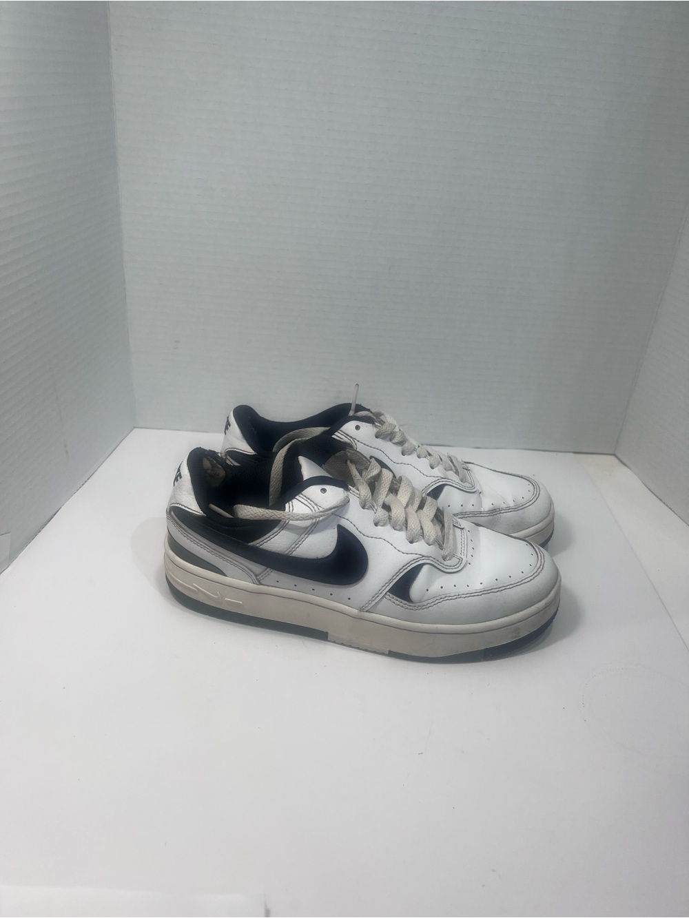Nike Men’s White and Black Low-Top Sneakers with Navy Swoosh